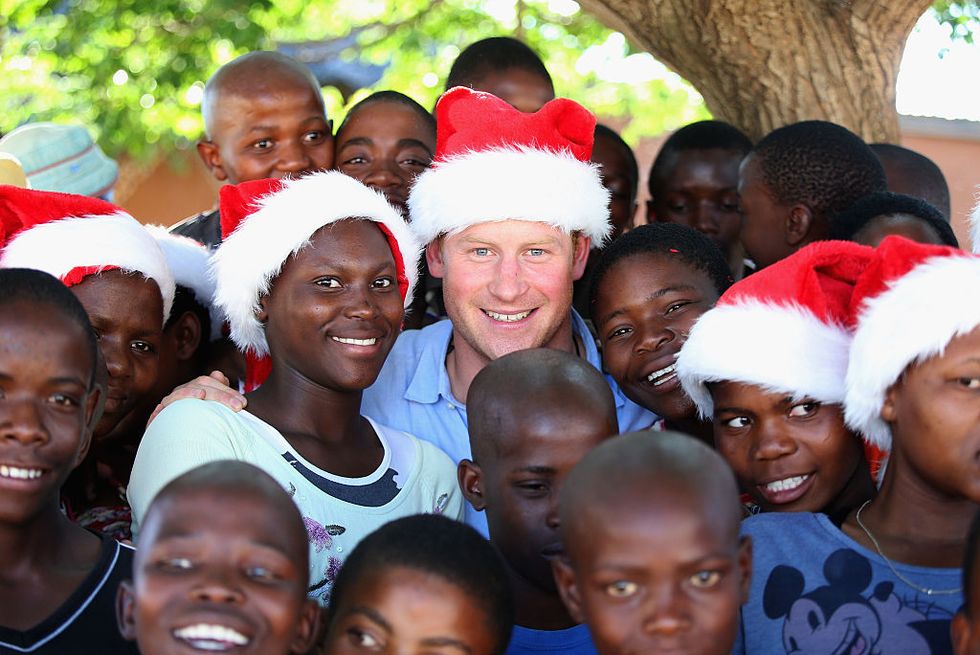 <p>They travel near and far to deliver messages of goodwill. In this photo from 2014, Prince Harry visits Lesotho to see the work of his charity Santebale, which provides healthcare and education to children in the region. Prince Harry co-founded the charity with Prince Seeiso in 2006. </p>