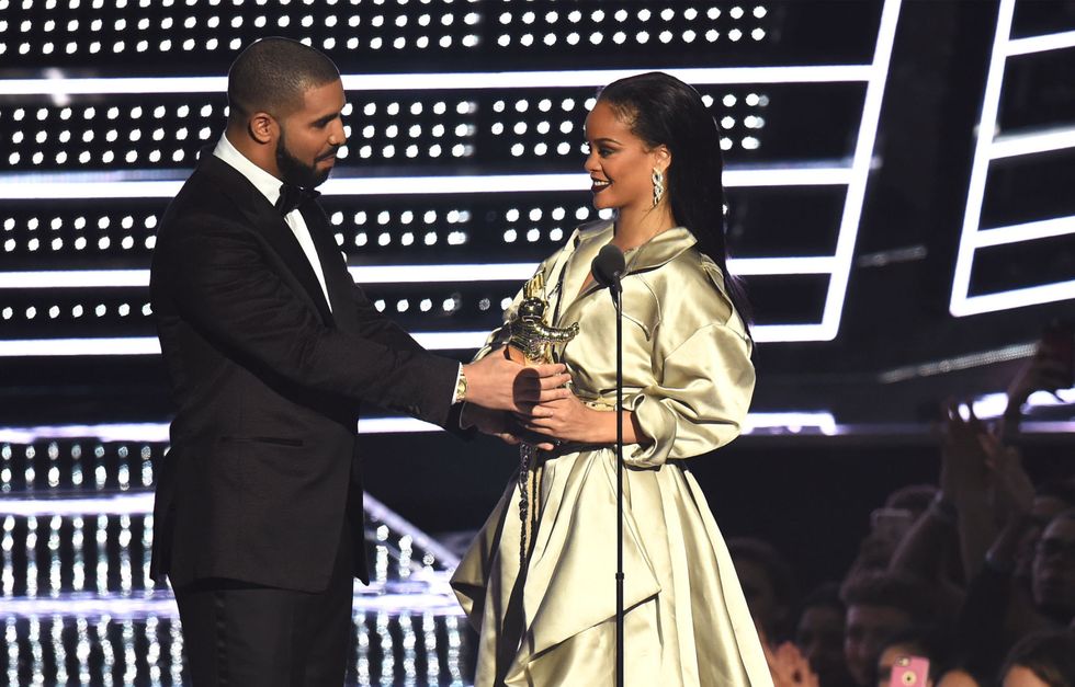 <p>Though we never fully got confirmation of an official Drake and Rihanna relationship<em data-redactor-tag="em" data-verified="redactor"> or</em> breakup, something <em data-redactor-tag="em" data-verified="redactor">definitely</em> went on and fizzled out between these two this year. The on and off again duo collaborated for the singer's steamy "Work" music video, kicking off a series of flirt-filled performances throughout spring and summer. It escalated to the next level when Drake bought a billboard to congratulate Riri and then surprised everyones  at the VMAs <a href="http://www.harpersbazaar.com/culture/film-tv/news/a17380/drake-rihanna-vmas-2016/" target="_blank" data-tracking-id="recirc-text-link">to present her the Vanguard Award</a> where he admitted he's "been in love with Rihanna since he was 22." Despite their <a href="http://www.harpersbazaar.com/celebrity/latest/a17522/drake-and-rihanna-matching-tattoos/" target="_blank" data-tracking-id="recirc-text-link">matching tattoos</a>, saying "I love you" and <a href="http://www.harpersbazaar.com/celebrity/latest/a17486/rihanna-drake-miami-duet-kiss/" target="_blank" data-tracking-id="recirc-text-link">flirty performances</a>, the couple reportedly <a href="http://www.harpersbazaar.com/celebrity/latest/a18172/rihanna-and-drake-broke-up-again/" target="_blank" data-tracking-id="recirc-text-link">broke up in October</a>—for now, that is. </p>