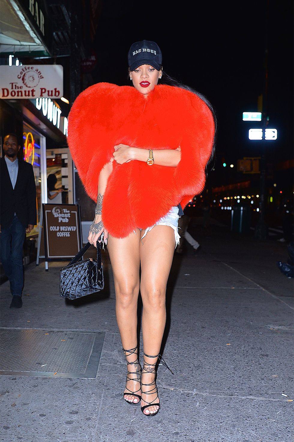 <p>The only thing more quintessentially Rihanna&nbsp;about wearing this <a href="http://www.harpersbazaar.com/celebrity/latest/a18484/rihanna-halloween-costumes-instagram/" target="_blank" data-tracking-id="recirc-text-link">heart-shaped fur coat</a> by Saint Laurent, is that she wore it with denim cut-offs and a baseball cap. Translate the look for winter with some leather pants and heeled boots.</p>
