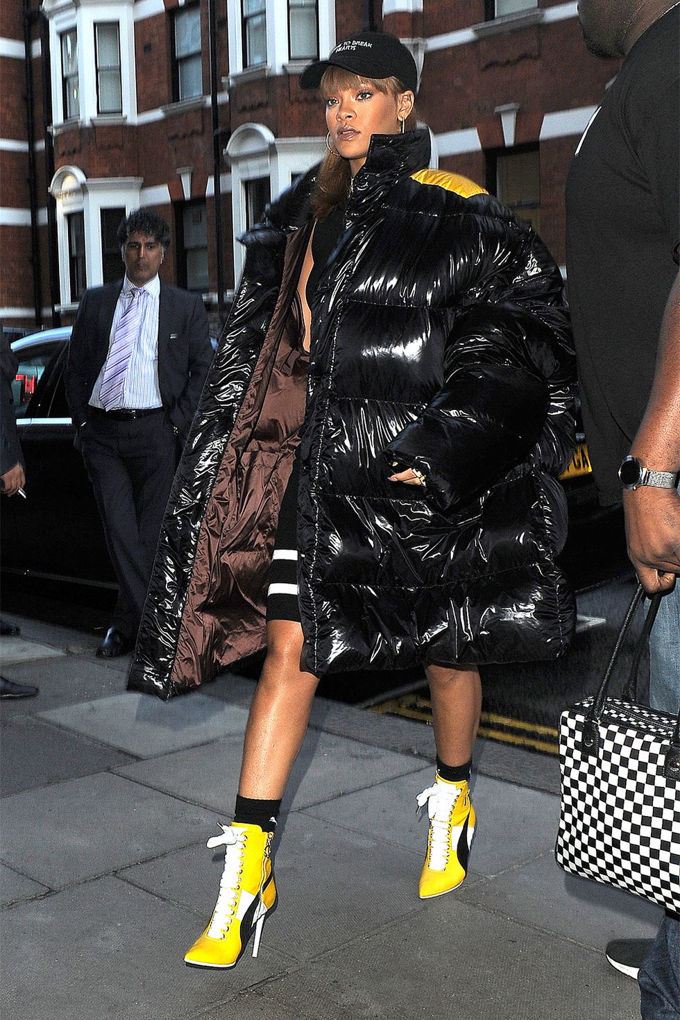 <p>Let a puffer with enough volume and shine,&nbsp;like RiRi's Raf Simons style,&nbsp;do the talking. Wear it over an LBD and some lace-up boots and you're good to go. (She wore this one in August too.)</p>
