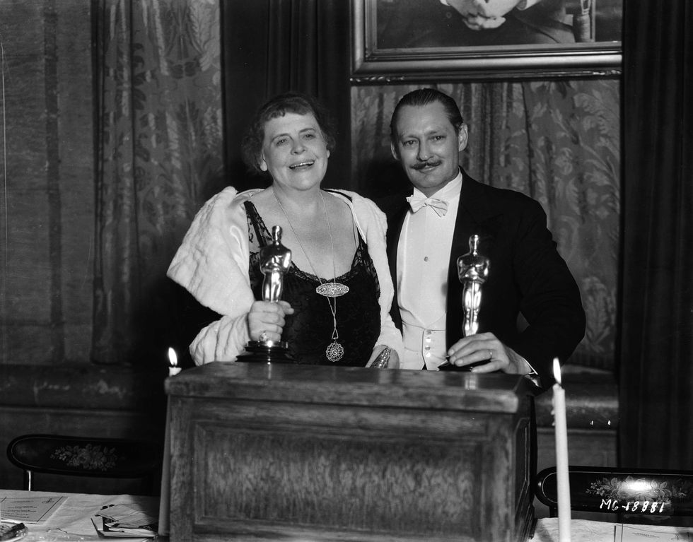<p>Marie Dressler (<i data-redactor-tag="i">Min and Bill</i>) and Lionel Barrymore (<i data-redactor-tag="i">A Free </i>Soul) pose with their Best Actor awards. Barrymore, a son and sibling of actors, was reluctant to join the family business. In addition to acting, he also studied fine art, composed orchestral music, and wrote a historic novel.<span class="redactor-invisible-space" data-verified="redactor" data-redactor-tag="span" data-redactor-class="redactor-invisible-space"></span></p>