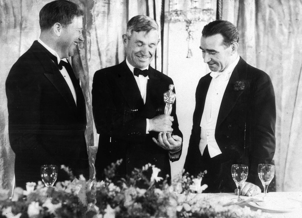 <p>Host Will Rogers stands between two winners, Franklin Hansen (Best Sound Recording, <i data-redactor-tag="i">A Farewell to Arms</i>) and Frank Lloyd (Best Director, <i data-redactor-tag="i">Cavalcade</i>). Rogers, when announcing Best Director, simply said, "Come up and get it, Frank," forgetting that two Franks, Lloyd and Capra, were nominees. Capra was halfway to the stage before Rogers' gaffe was clarified.&nbsp;<span class="redactor-invisible-space" data-verified="redactor" data-redactor-tag="span" data-redactor-class="redactor-invisible-space"></span></p>