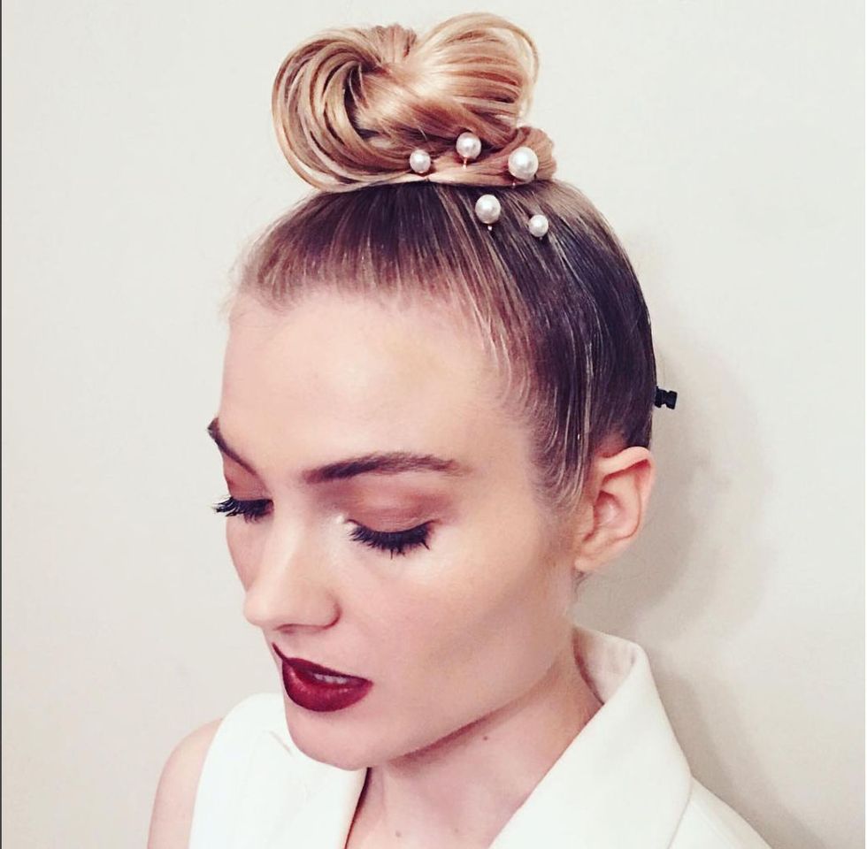 <p>Actress Skyler Samuels models one way to wear pearly pins: stick a whole bunch of them in a sleek top knot for&nbsp;instantly elevated style.</p>