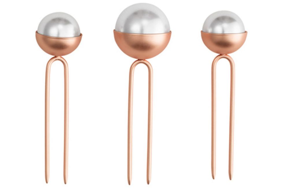 <p>Partly because they've been seen&nbsp;on dozens of celebrities (including Grande and Collins above), these metallic and pearl pis from Chloe + Isabel and hairstylist Jen Atkin are hard to get your hands on (you'll need to try eBay).&nbsp;</p><p><em data-redactor-tag="em" data-verified="redactor">Chloe + Isabel Pearl Bun Trio, $28, <a href="https://www.chloeandisabel.com/products/H056WHRG/oversized-pearl-bun-pin-set" target="_blank" data-tracking-id="recirc-text-link">ChloeandIsabel.com</a>.</em></p>