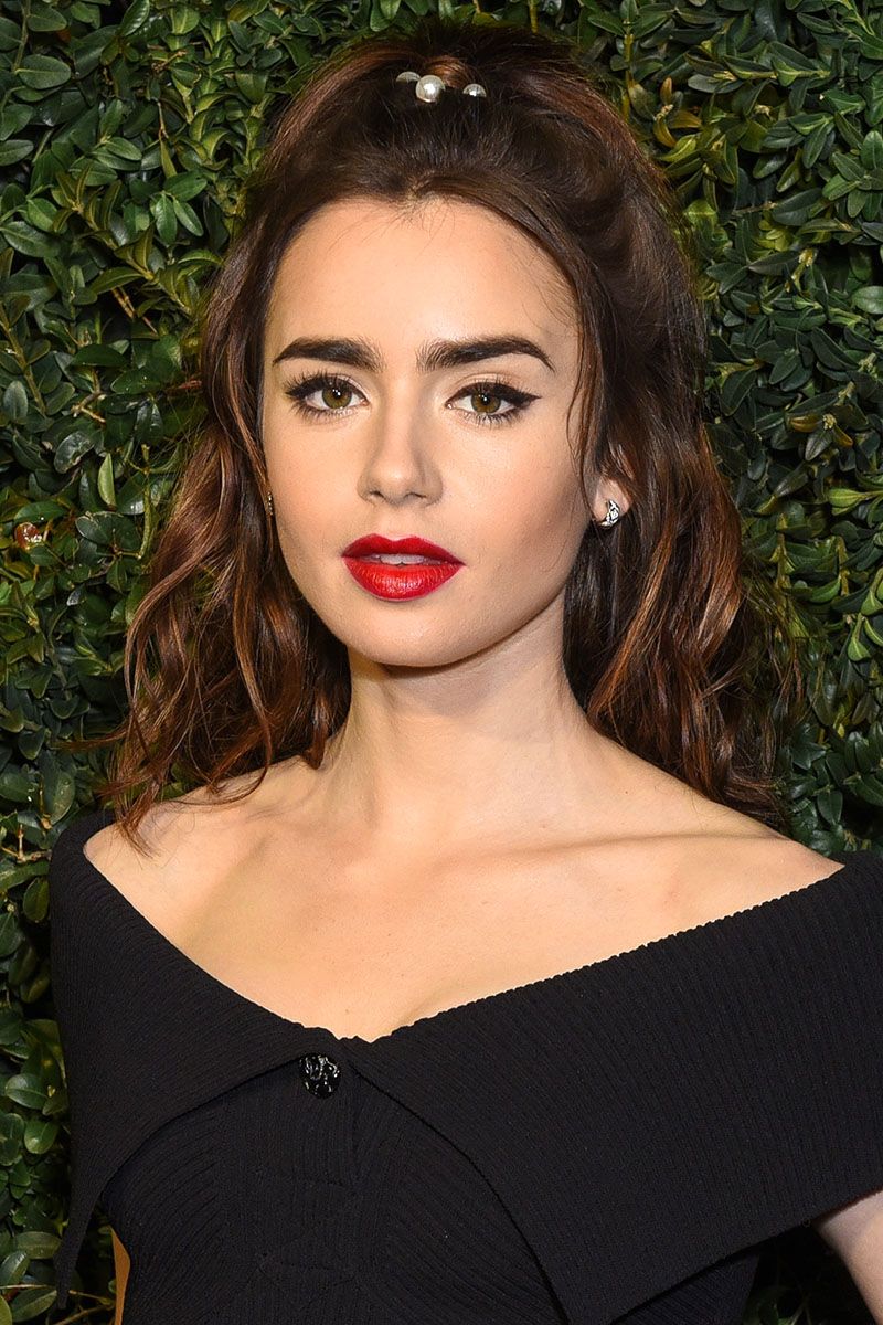 <p>Lily Collins dressed up a wavy half-up ponytail with pins from hairstylist Jen Atkin's <a href="https://www.chloeandisabel.com/shop/jen-atkin" target="_blank" data-tracking-id="recirc-text-link">Chloe + Isabel collection</a>.</p>