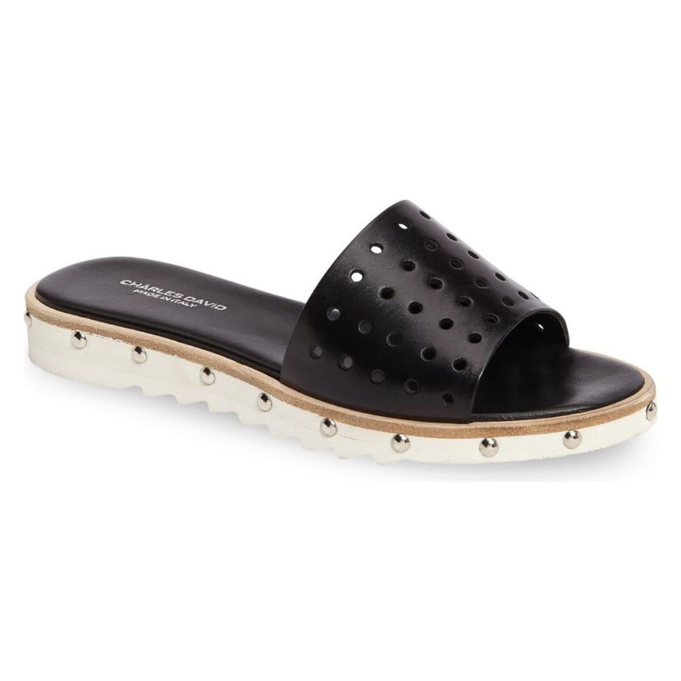 <p>Charles David, $189; <a href="https://www.bloomingdales.com/shop/product/charles-david-space-perforated-studded-slide-sandals?ID=2452582&amp;pla_country=US&amp;cm_mmc=Google-PLA-ADC-_-Women%27s%20Shoes-NA-_-Charles%20David-_-690152095391USA&amp;CAWELAID=120156070004830841&amp;CAGPSPN=pla&amp;CAAGID=35637446592&amp;CATCI=pla-264523664549&amp;catargetid=120156070004254554&amp;cadevice=c" target="_blank" data-tracking-id="recirc-text-link">bloomingdales.com</a></p>
