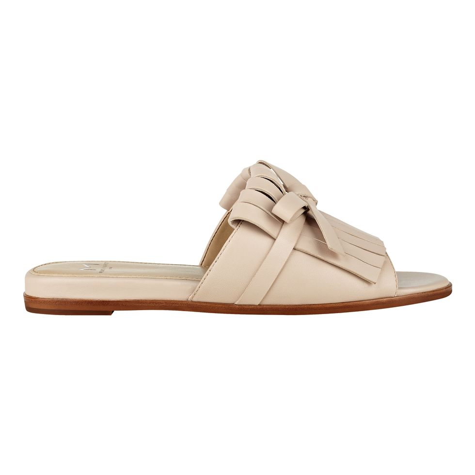 <p>Marc Fisher LTD, $140; <a href="http://www.marcfisherfootwear.com/whitley-kiltie-slide-sandal-1" target="_blank" data-tracking-id="recirc-text-link">marcfisherfootwear.com</a></p>