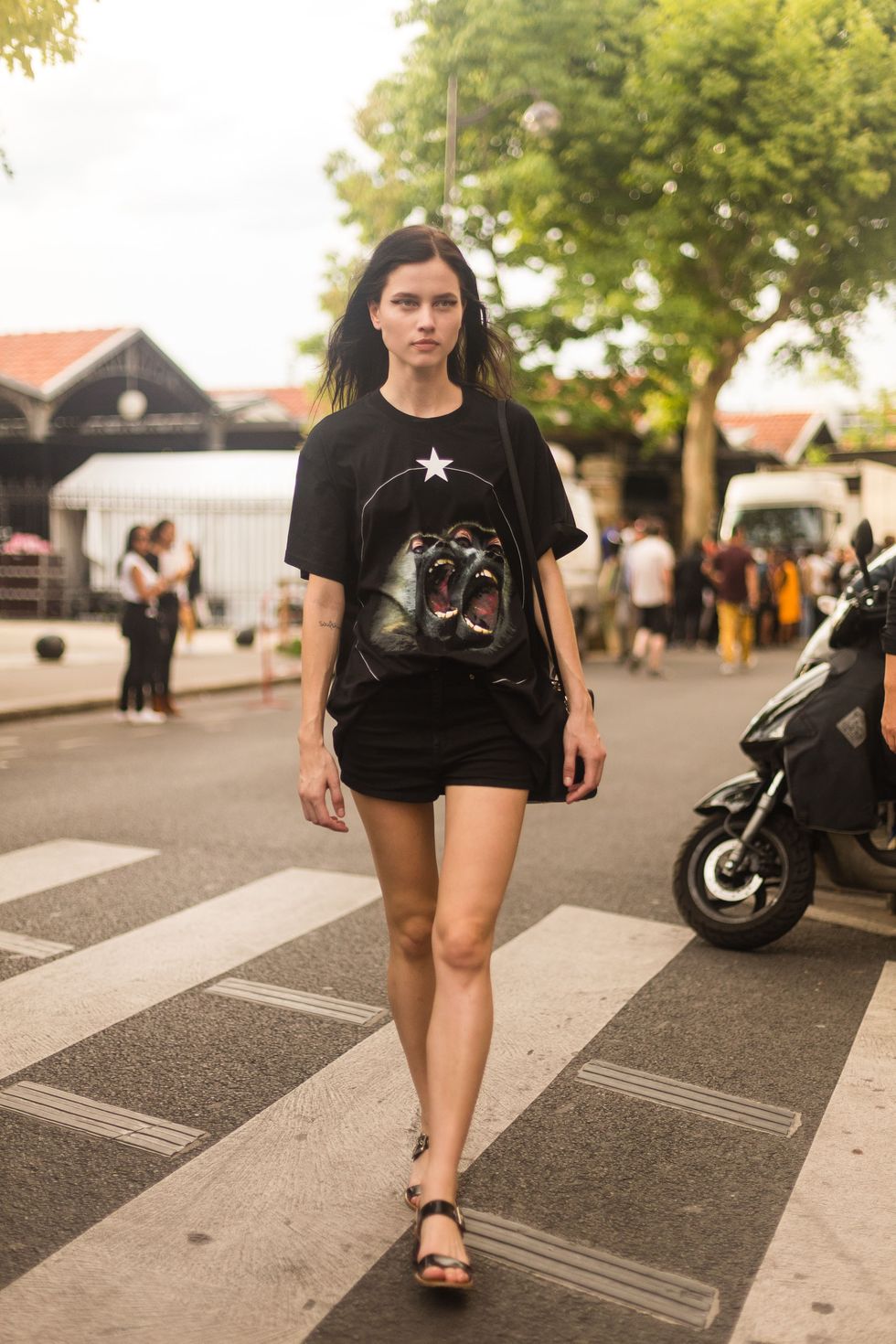 PARIS, FRANCE - JUNE 26:  Model Isis Bataglia exits the Givenchy show in a Givenchy t-shirt on June 26, 2015 in Paris, France.  (Photo by Melodie Jeng/Getty Images)