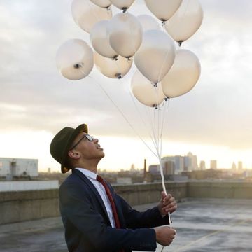 Balloon, Lighting, Sky, Suit, Architecture, Photography, Stock photography, Sitting, Cloud, Formal wear, 