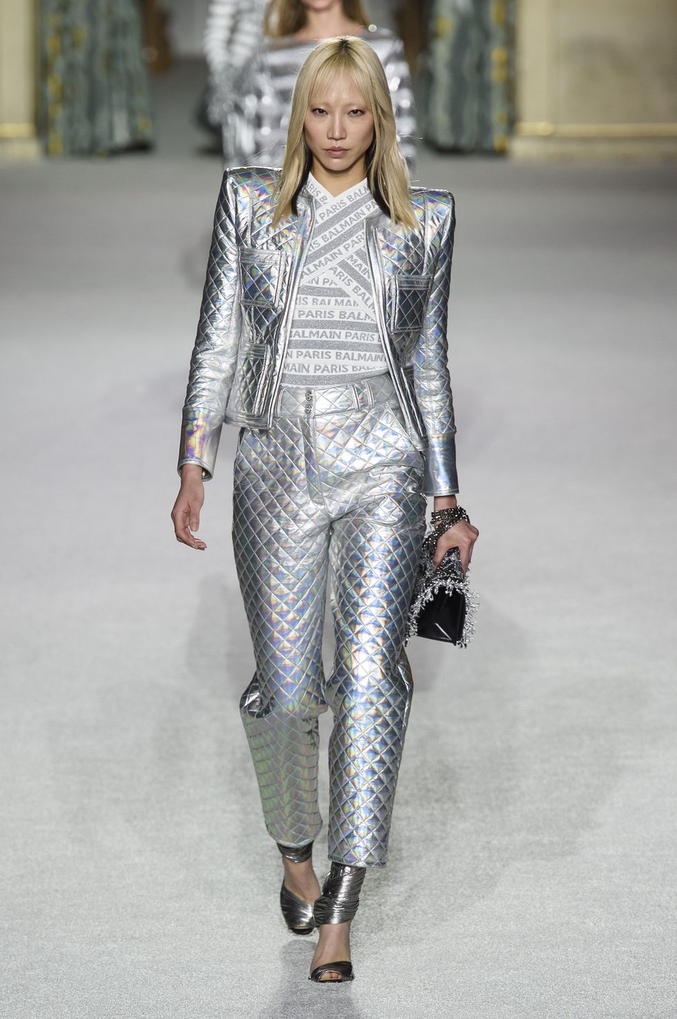 Fashion model, Fashion, Fashion show, Runway, Clothing, Haute couture, Blond, Silver, Transparent material, Outerwear, 