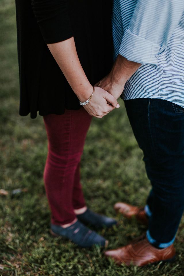 People in nature, Photograph, Green, Red, Holding hands, Grass, Footwear, Interaction, Gesture, Hand, 