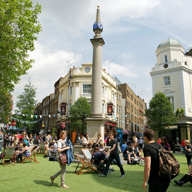Tree, Tower, Public space, Tourism, Street light, Pole, Finial, Lawn, Town square, Park, 