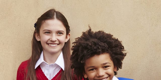 Hair, Smile, Collar, Sleeve, Standing, Happy, Facial expression, Style, Uniform, Tooth, 