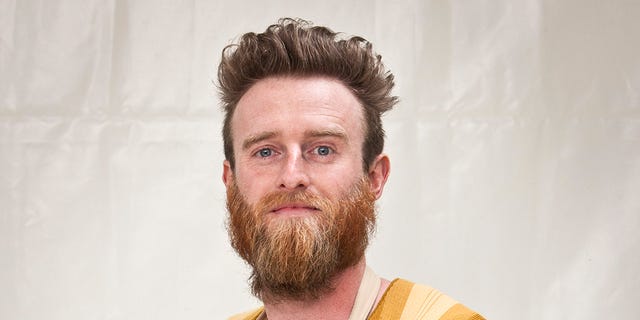 Facial hair, Hairstyle, Beard, Jaw, Moustache, Sweater, Chest, Peach, Brown hair, Ice cream, Facial hair, Hairstyle, Beard, Jaw, Moustache, Sweater, Chest, Peach, Brown hair, Ice cream,