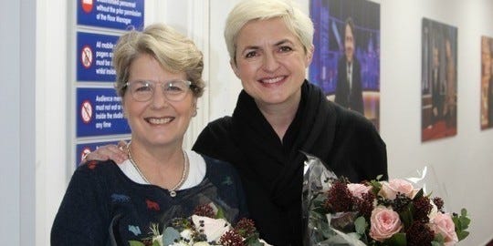 Glasses, Vision care, Smile, Eye, Photograph, Community, Facial expression, Bouquet, Flowering plant, Picture frame, 