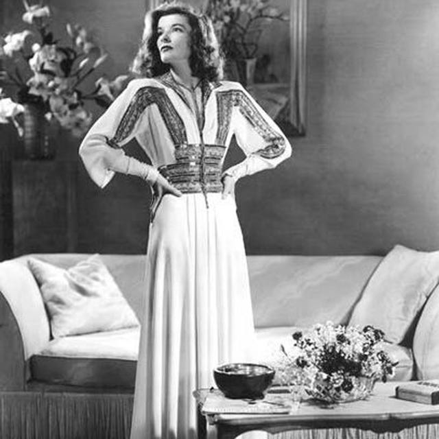 Style, Vintage clothing, Living room, Serveware, Costume design, Couch, One-piece garment, Fashion design, Jheri curl, Fashion model, 