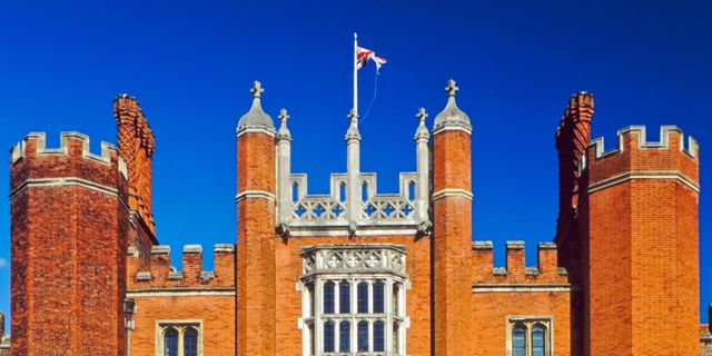 Flag, Facade, Landmark, Medieval architecture, Arch, Palace, Castle, Mansion, Turret, Classical architecture, 