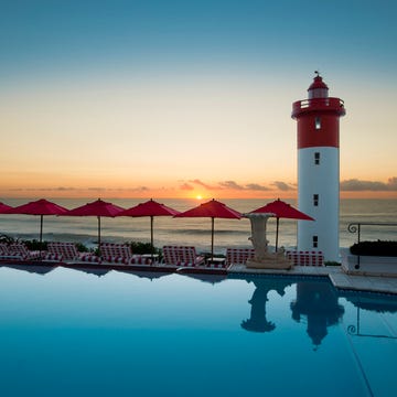 Body of water, Tower, Reflection, Coastal and oceanic landforms, Beacon, Horizon, Dusk, Sunset, Landmark, Ocean, 