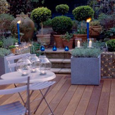 Lavender, Hardwood, Garden, Flowerpot, Tablecloth, Shrub, Wood flooring, Lawn ornament, Laminate flooring, Water feature, 