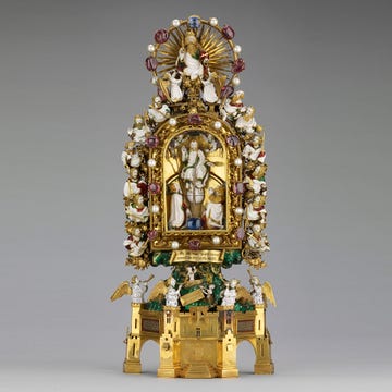 Brass, Metal, Sculpture, Gold, Temple, Place of worship, Crown, Artifact, Bronze, Tradition, 