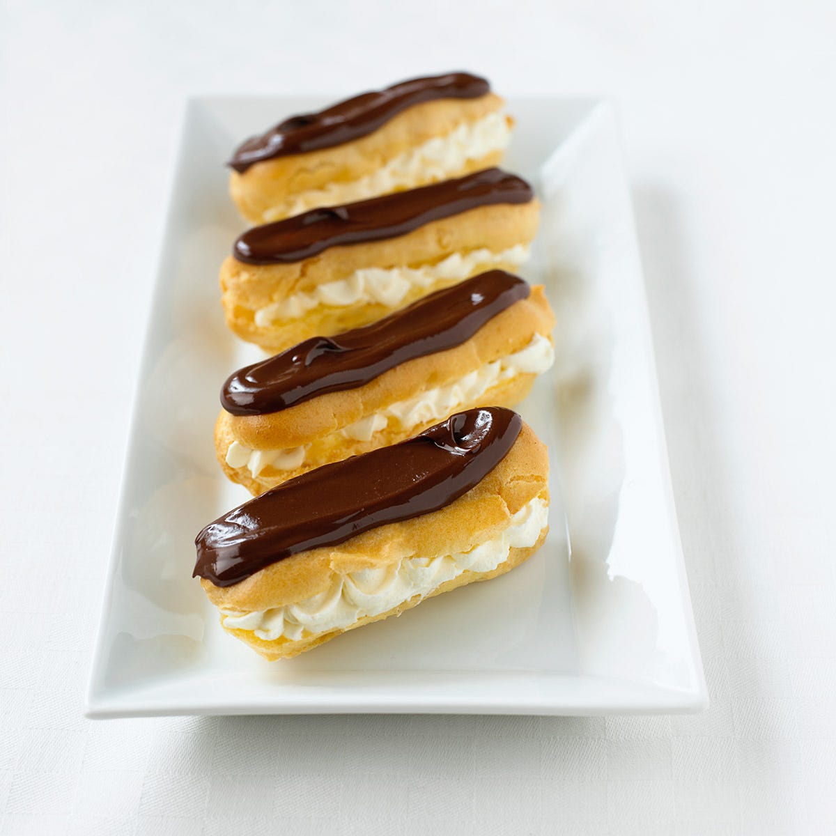 It's not the hardest job in the world - taste testing chocolate eclairs!