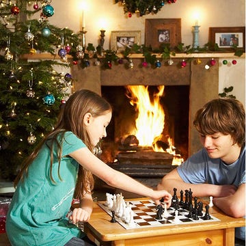 Arm, Wood, Indoor games and sports, Lighting, Green, Room, Chessboard, Chess, Recreation, Board game, 