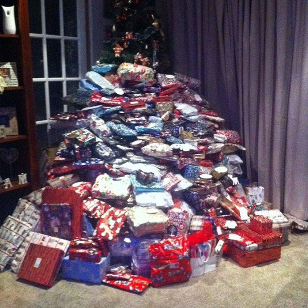 lots of christmas presents under tree