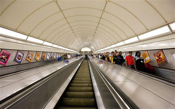 Escalator, People, Brown, Transport, Yellow, Urban area, Infrastructure, Standing, Ceiling, Line, 