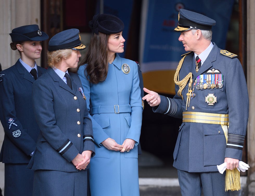Military uniform, Sleeve, Collar, Dress shirt, Uniform, Standing, Military person, Formal wear, Hat, Cap, 