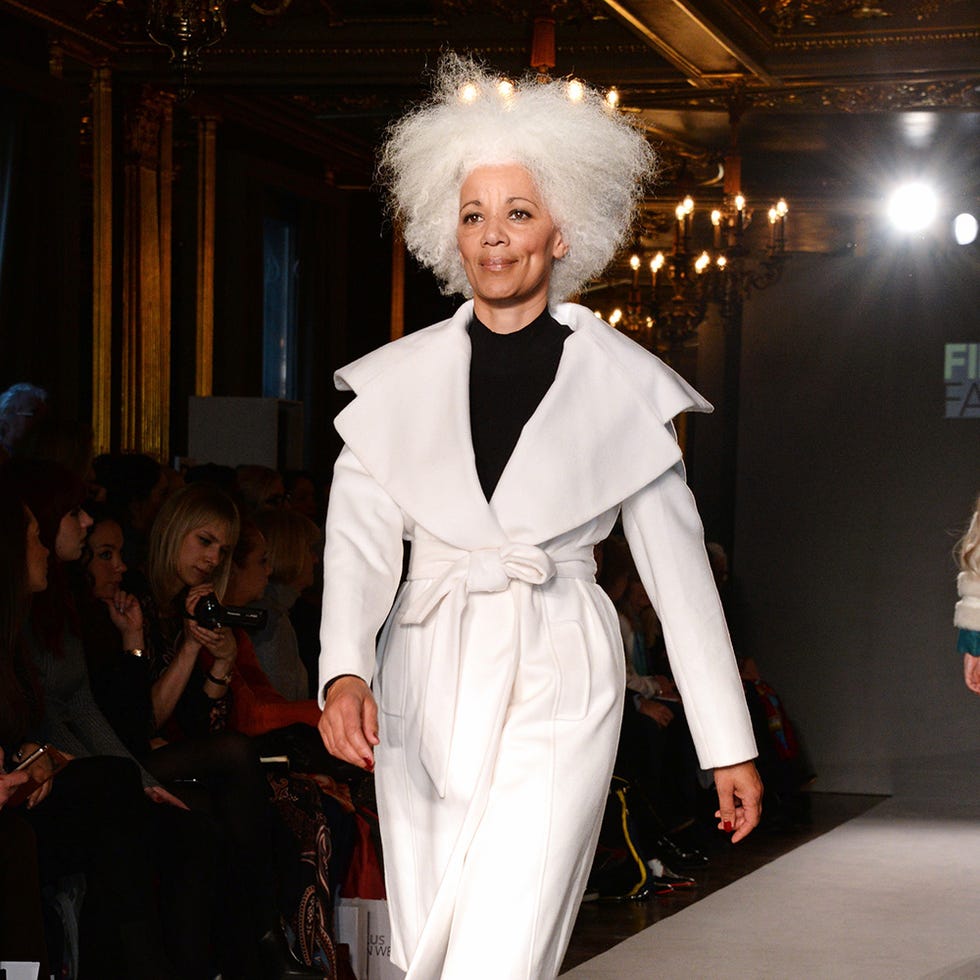 Outerwear, Costume accessory, Fashion, Costume, Wig, Fur, Fashion model, Costume design, Fashion design, Costume hat, 
