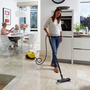 Floor, Flooring, Room, Interior design, Vacuum cleaner, Interior design, T-shirt, Denim, Picture frame, Houseplant, 