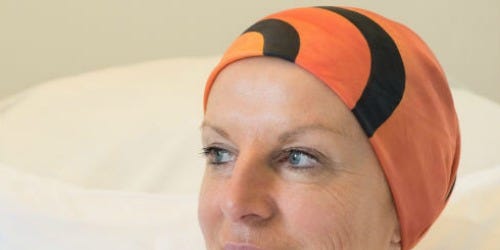 Lip, Forehead, Eyebrow, Orange, Headgear, Wrinkle, Throat, Swim cap, Linens, 