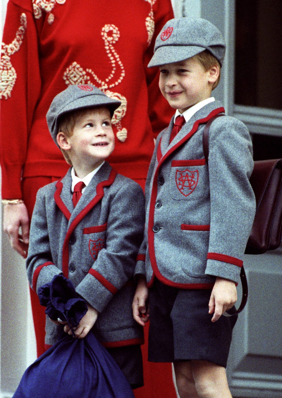 Sleeve, Red, Collar, Outerwear, Standing, Uniform, Style, Headgear, Costume accessory, Costume hat, 