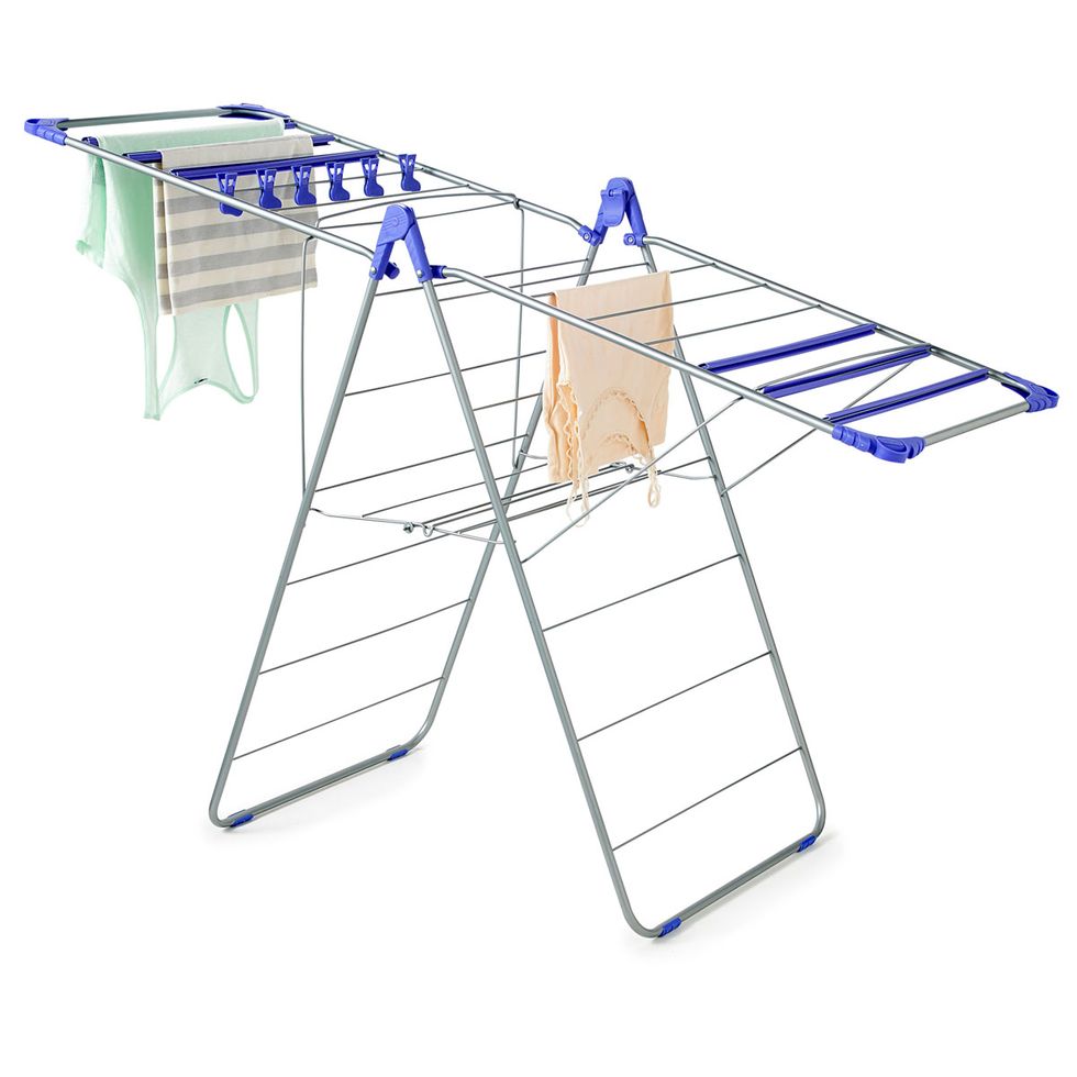 Basketball hoop, Table, Clotheshorse, Furniture, Ironing board, Folding chair, Laundry supply, Clothes hanger, Parallel, Household supply, 
