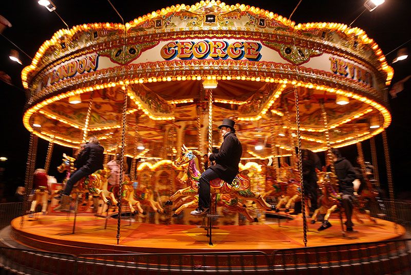 Fun, Amber, Night, Light, Amusement ride, Amusement park, Carousel, Public event, Fair, Electricity, 