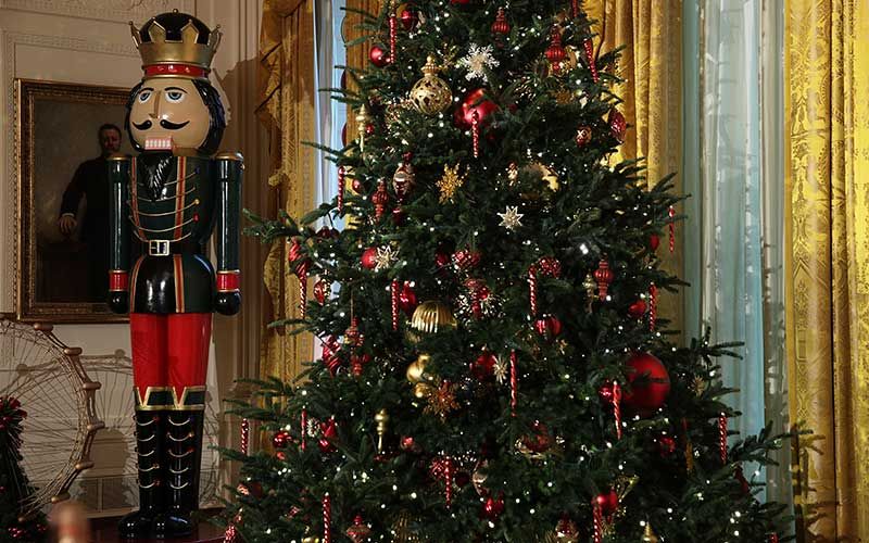 Christmas decoration, Event, Christmas tree, Interior design, Red, Christmas ornament, Nutcracker, Interior design, Decorative nutcracker, Holiday, 