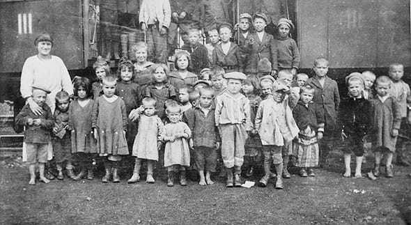 People, Social group, Standing, History, Child, Team, Family, Uniform, 