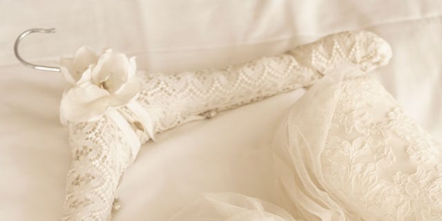 White, Embellishment, Wedding dress, Lace, Ivory, Bridal accessory, Natural material, Knot, Bridal shoe, Fashion design, 