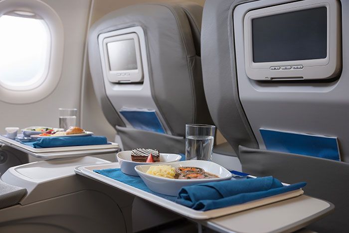 Aircraft cabin, Dishware, Airline, Air travel, Service, Meal, Plate, Display device, Aircraft, Serveware, 