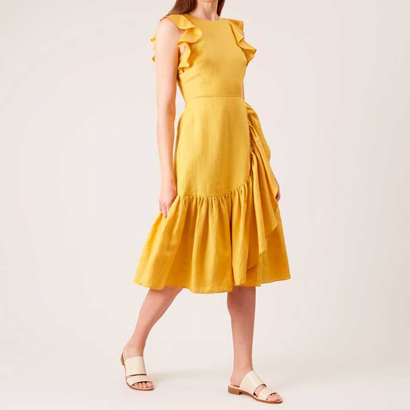 Clothing, Yellow, Sleeve, Dress, Shoulder, Human leg, Joint, Standing, One-piece garment, Formal wear, 