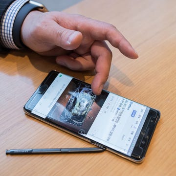 Wallet, Hand, Finger, Gadget, Technology, Material property, Font, Electronic device, Smartphone, Mobile phone, 