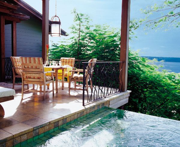 Property, Real estate, Porch, Home, Outdoor furniture, House, Fluid, Chair, Water feature, Deck, 