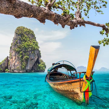 Water transportation, Tropics, Natural landscape, Long-tail boat, Boat, Tree, Sky, Tourism, Water, Vehicle, 