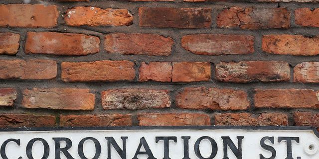 Brickwork, Brick, Wall, Text, Font, Stone wall, Signage, Sign, Number, Nameplate, 