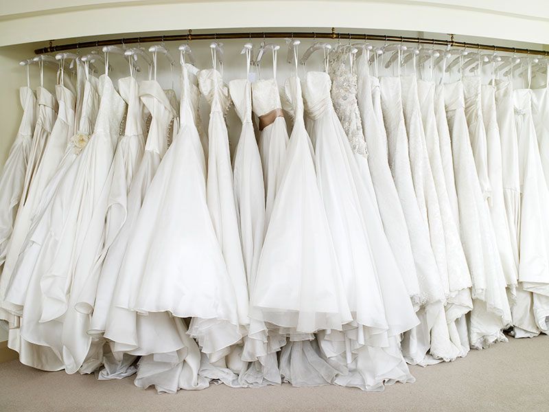 White, Dress, Curtain, Room, Textile, Ceiling, Clothes hanger, Bridal party dress, Interior design, Bridal clothing, 