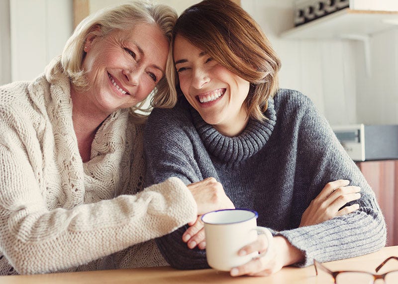 People, Facial expression, Coffee cup, Smile, Cup, Happy, Child, Breakfast, Electronic device, Sitting, 