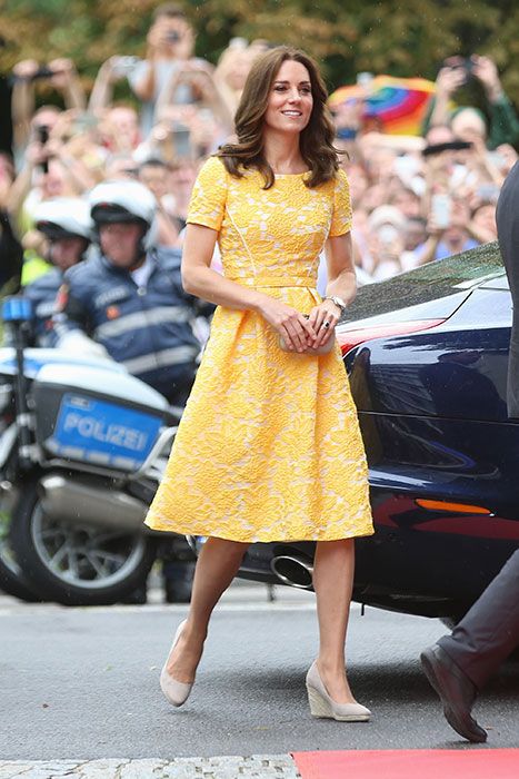 Kate Middleton has stepped out in a custom yellow lace dress from