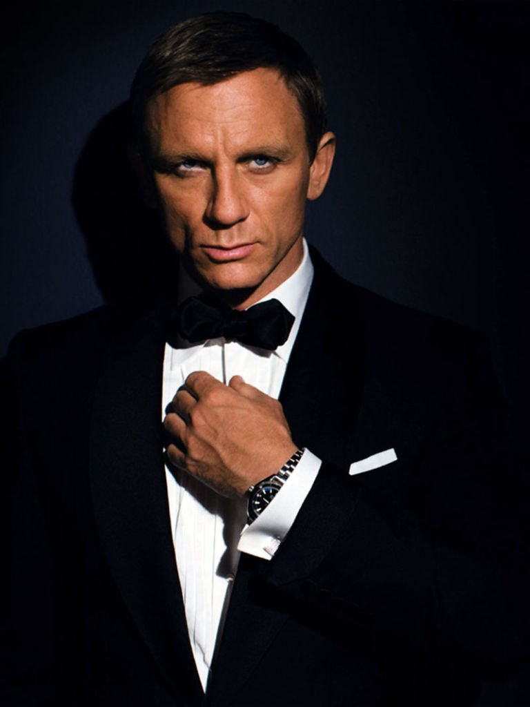 Suit, Formal wear, Tuxedo, Chin, Cheek, Tie, White-collar worker, Photography, Bow tie, Fashion accessory, 