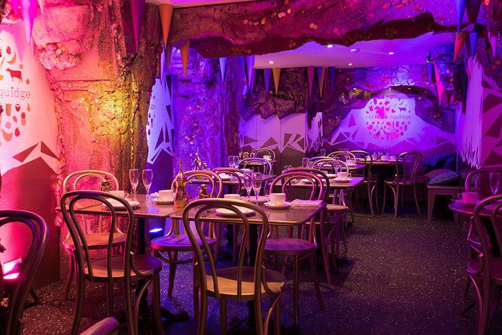 Purple, Light, Violet, Lighting, Function hall, Restaurant, Magenta, Room, Table, Interior design, 