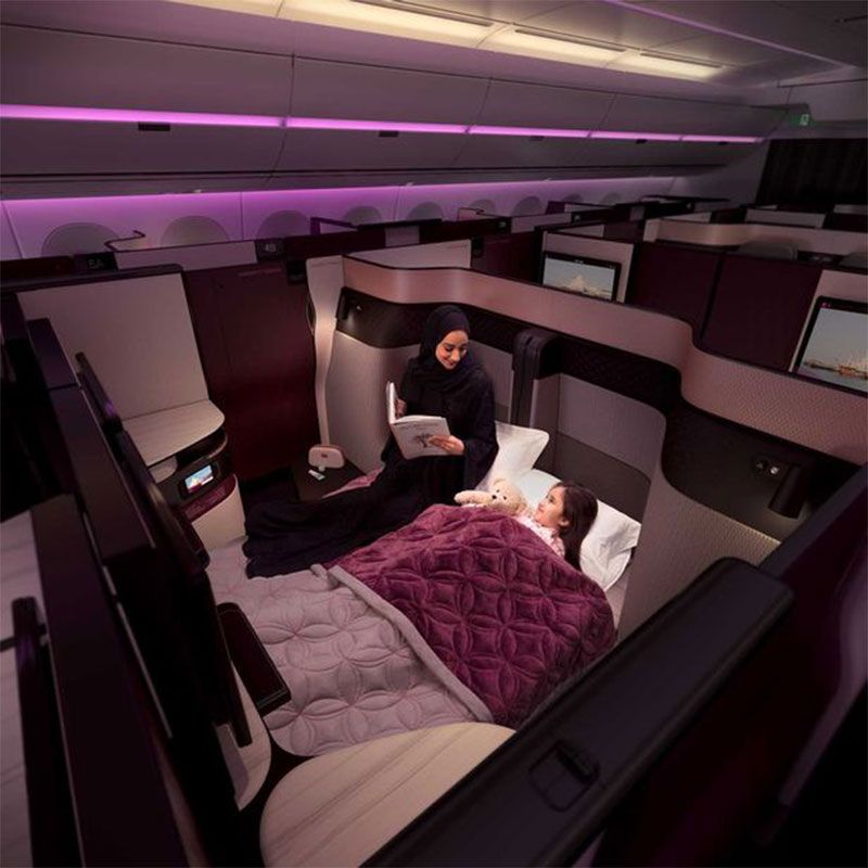 Airline, Air travel, Room, Aircraft cabin, Furniture, Magenta, Airliner, Bed, Interior design, Vehicle, 